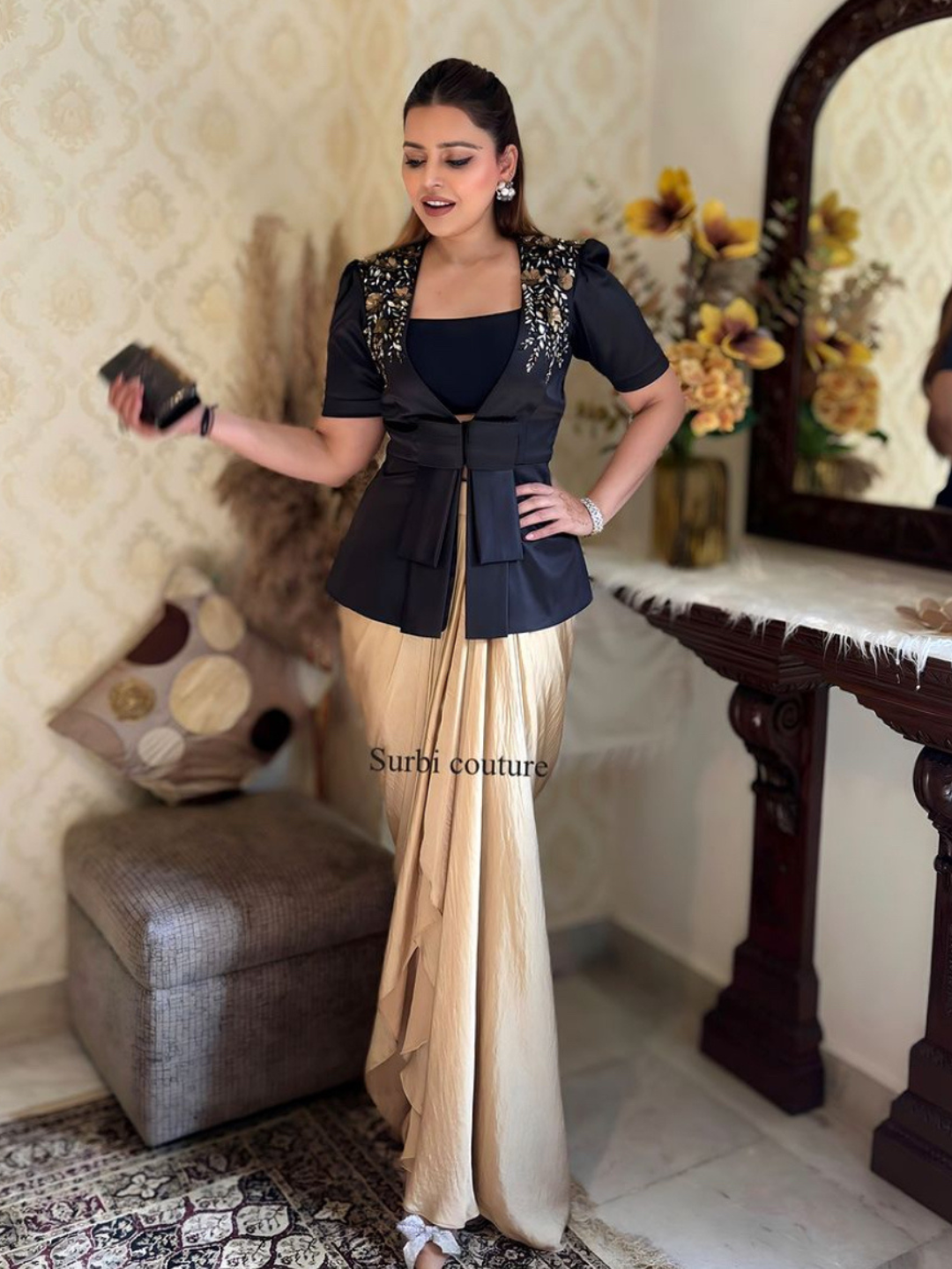 3D Embroidered jacket teamed up with a draped skirt